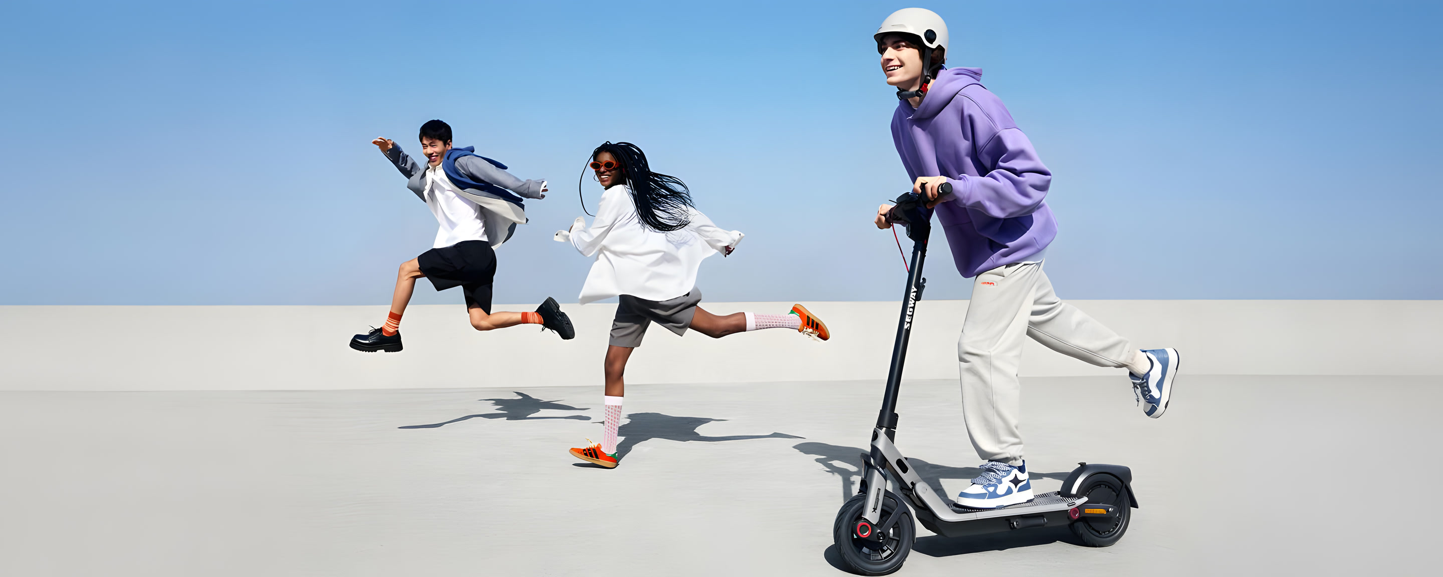 Friends riding next to a Segway E3 Pro