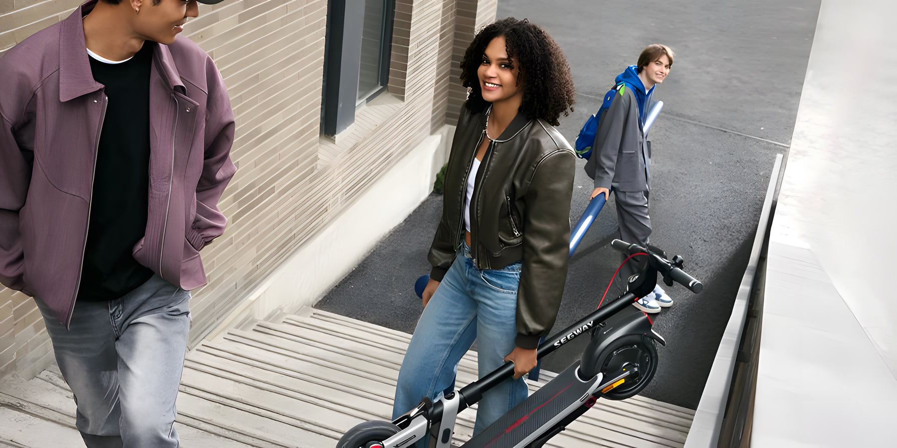Carrying a folded Segway E3 Pro up the stairs